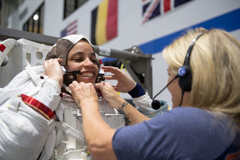 NASA astronaut Jessica Watkins is helped into a spacesuit