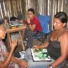 medical workers interview a Tsimane woman