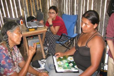 medical workers interview a Tsimane woman