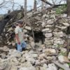 man beside a rocky mound