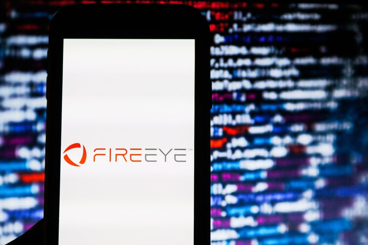 A smart phone displaying the FireEye logo