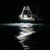 A fishing boat at night.