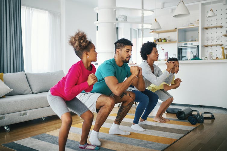 parents and kids working out at home together