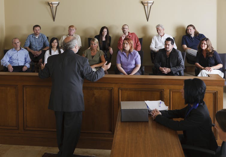 Lawyer speaking to jurors in a courtroom