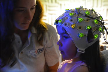 Child wearing a EEG cap