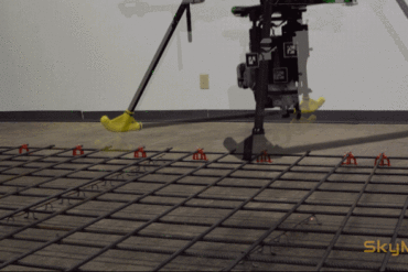 Animated image of a drone floating over rebar and tying it together at intersections.