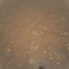 This NASA photo obtained April 25, 2021 shows the first color image of the Martian surface taken by an aerial vehicle while it w