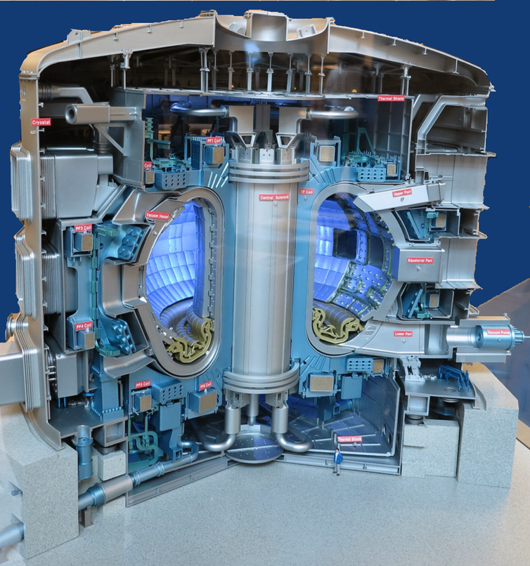 A cutaway illustration of a massive metal structure with a cylindrical core surrounded by a hollow ring filled with blue light
