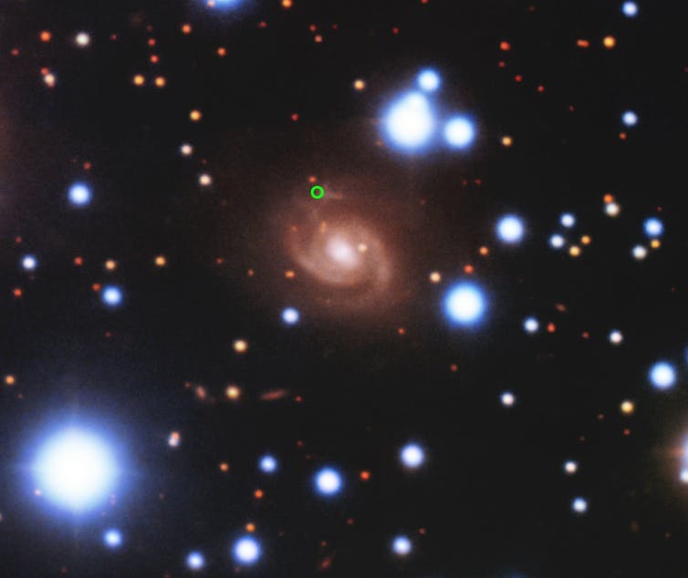 A photo showing multiple galaxies and stars against the backdrop of space