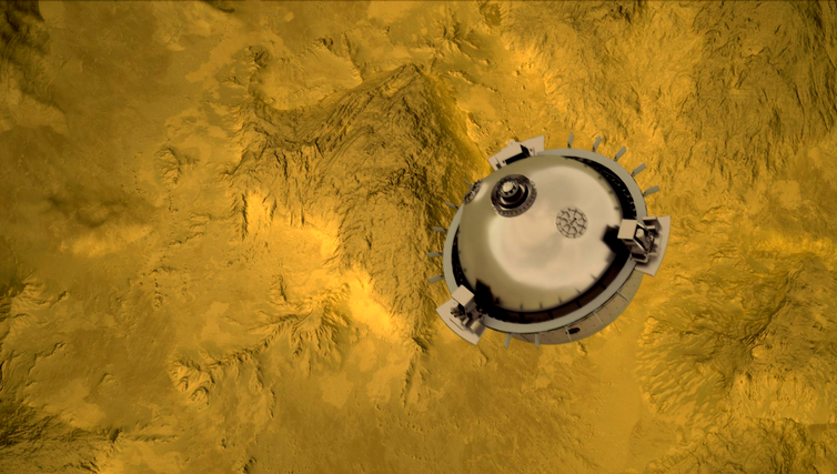 A circular probe with sampling equipment on it falling towards Venus.