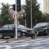 Two cars in an intersection after colliding.