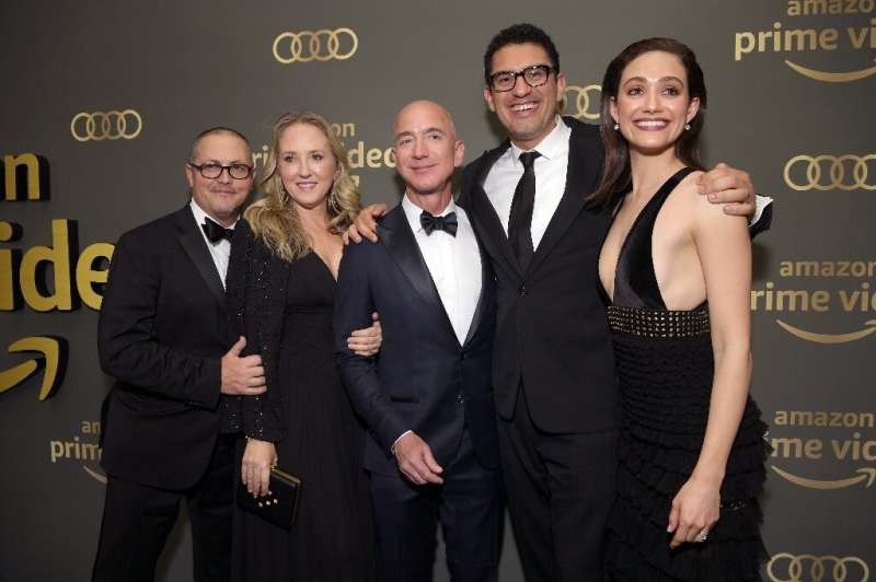 Jeff Bezos (center) is seen at  the Amazon Prime Video's Golden Globe Awards After Party in 2019 highlighting the success of Ama