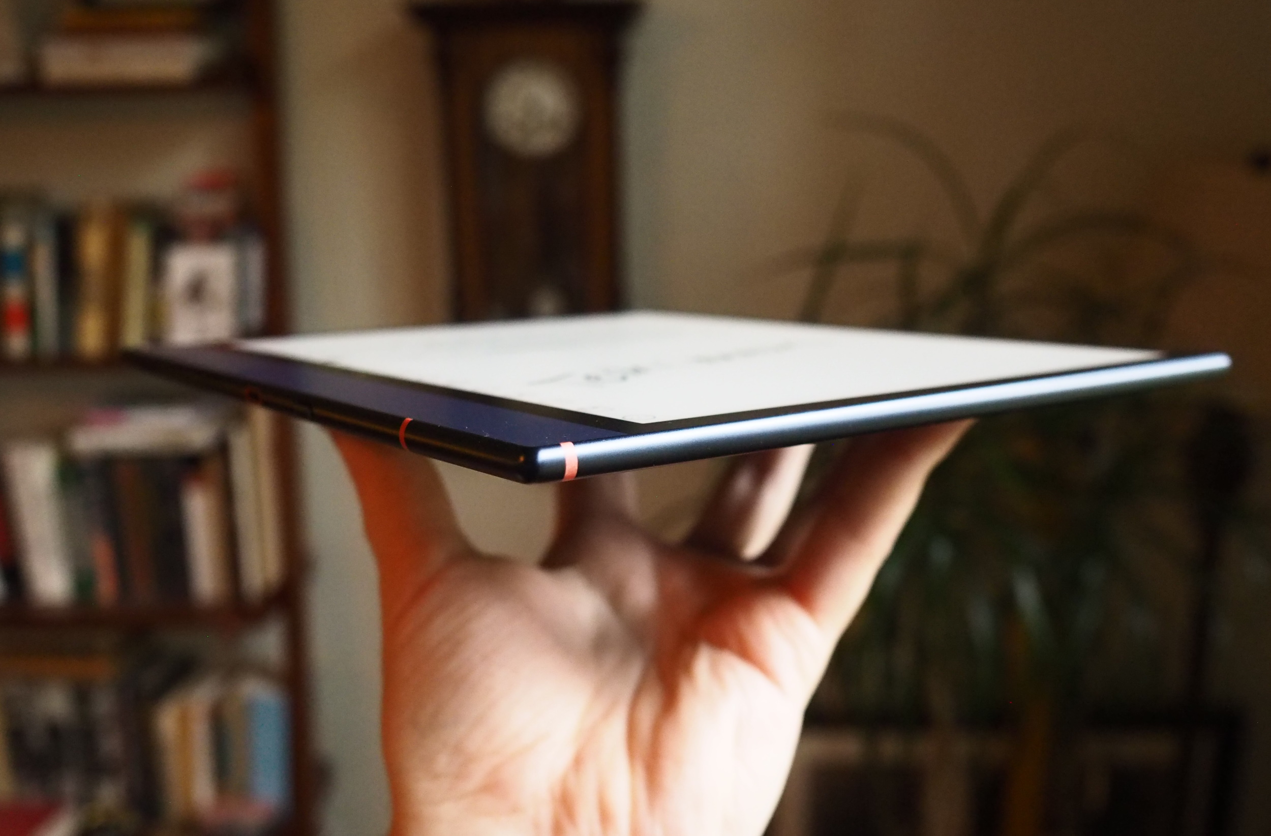 Side view of a tablet showing its thin profile and metal finish.