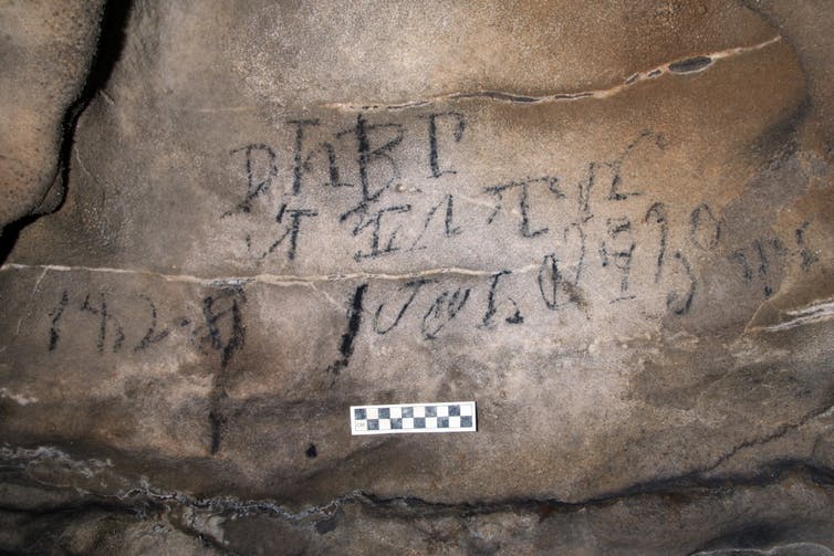 Inscription on cave wall written in Cherokee syllabary