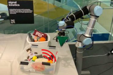 Robotic arm fuses data from a camera and antenna to locate and retrieve items