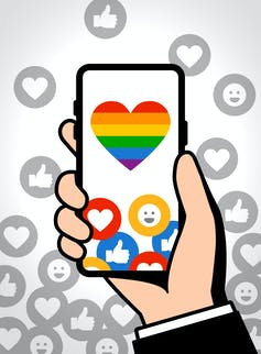 Illustration phone with rainbow heart on the screen, surrounded by positive reaction symbols.