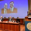 Large screen displaying the winners of the 2021 Nobel Prize in Physiology or Medicine