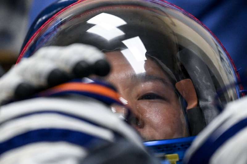 Yusaku Maezawa has his spacesuit tested during pre-launch preparations at the Baikonur cosmodrome