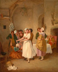 19th century painting of people celebrating with a bunch of mistletoe overhead