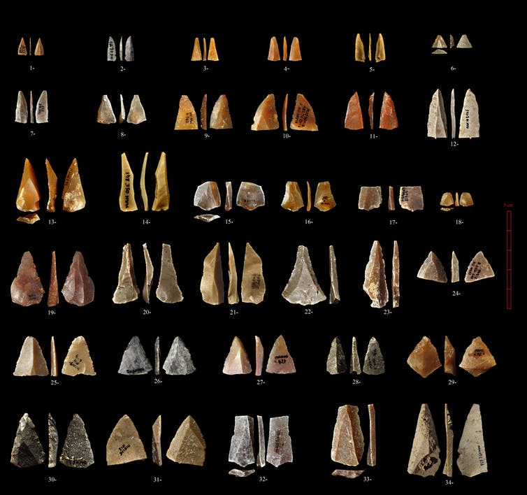 Triangular stone points against black background.