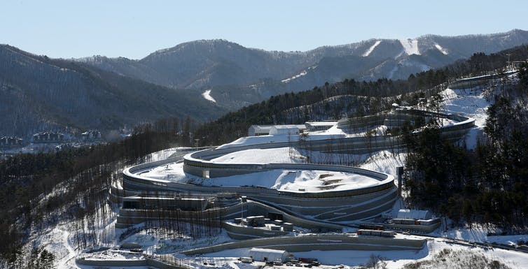 An aerial view of a large twisting covered track.