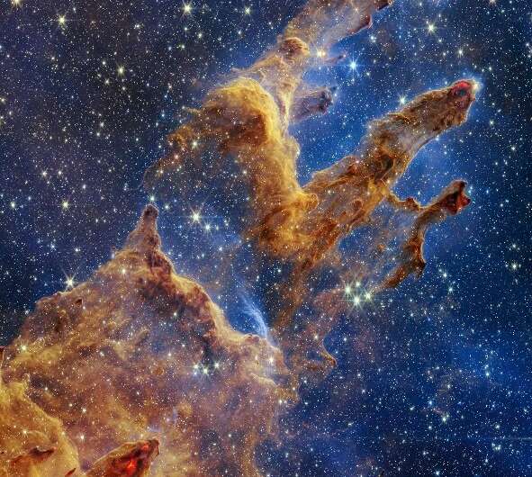 This handout photo provided by NASA on October 19, 2022 shows the 'Pillars of Creation' that are set off in a kaleidoscope of co