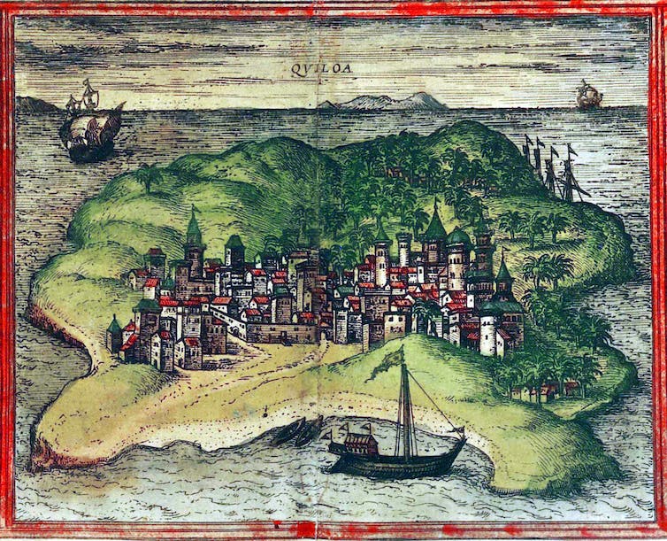 old color map of a hilly island with a town on one side