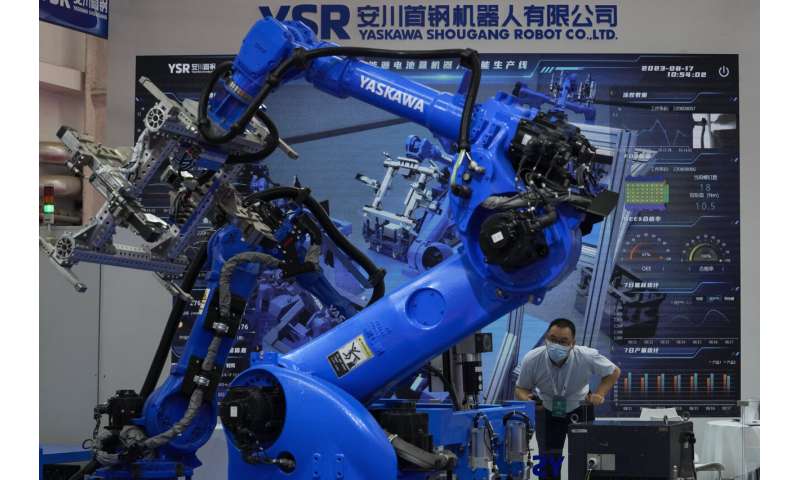 Lifelike robots and android dogs wow visitors at Beijing robotics fair
