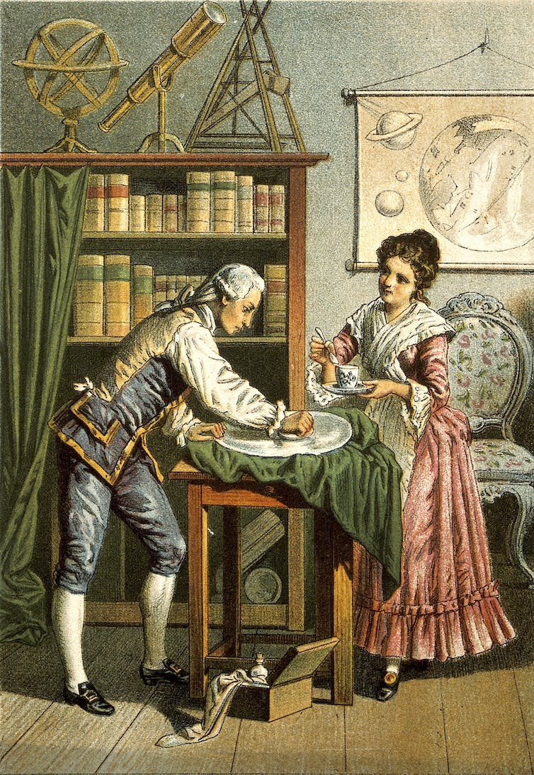 An illustration of two people, and man and a woman, leaning over a table. The man polishes a lens on the table. Other astronomical instruments are visible behind them.