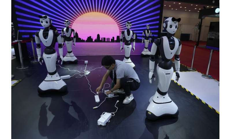 Lifelike robots and android dogs wow visitors at Beijing robotics fair