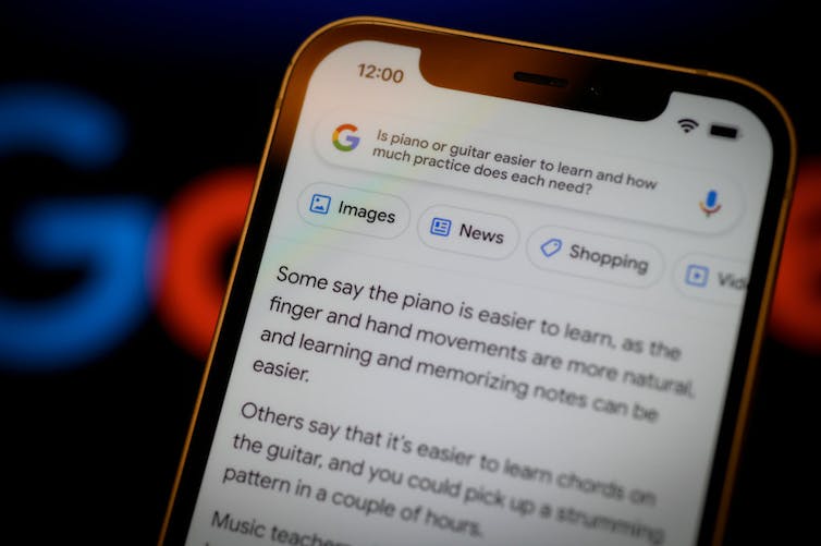 a closeup of a phone's screen shows a prompt about the ease of learning piano or guitar and a google bard's response.