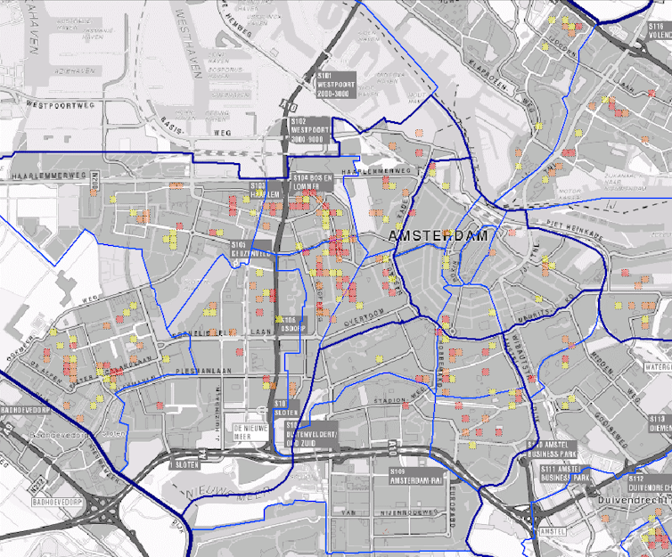 A city map with numerous small red, orange and yellow squares