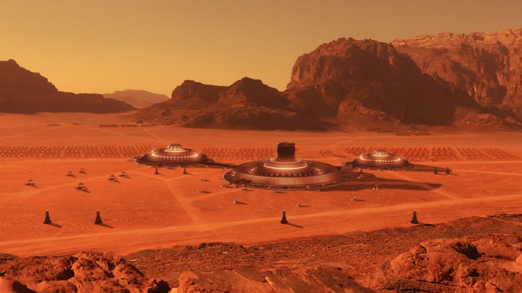 An illustration of several buildings on a red desert landscape.