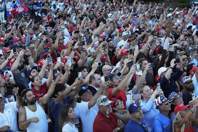 people largely dressed in patriotic colors at a Trump rally