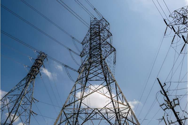 Electricity transmission towers are seen in Houston, Texas