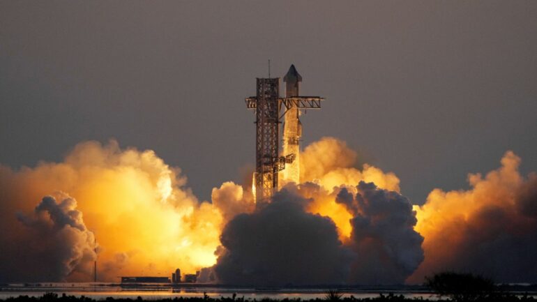 SpaceX catches Starship rocket booster as it returns to Earth ...