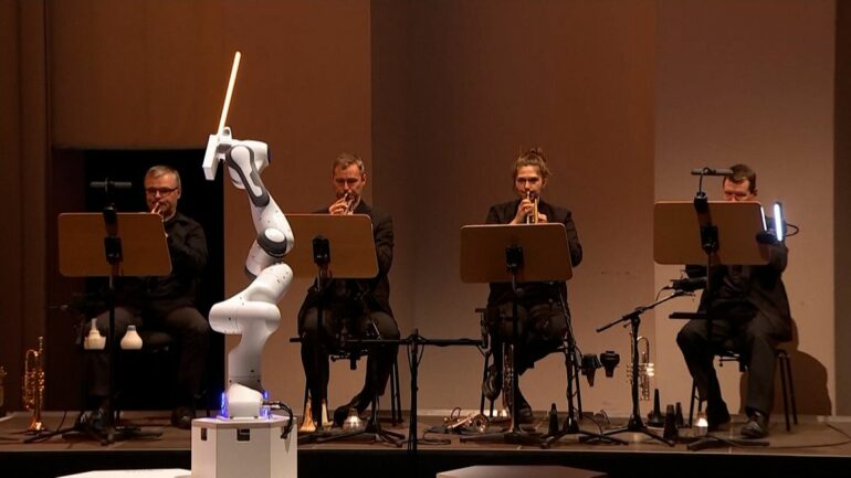 Slave to the rhythm: Three-armed robot conducts German symphony ...