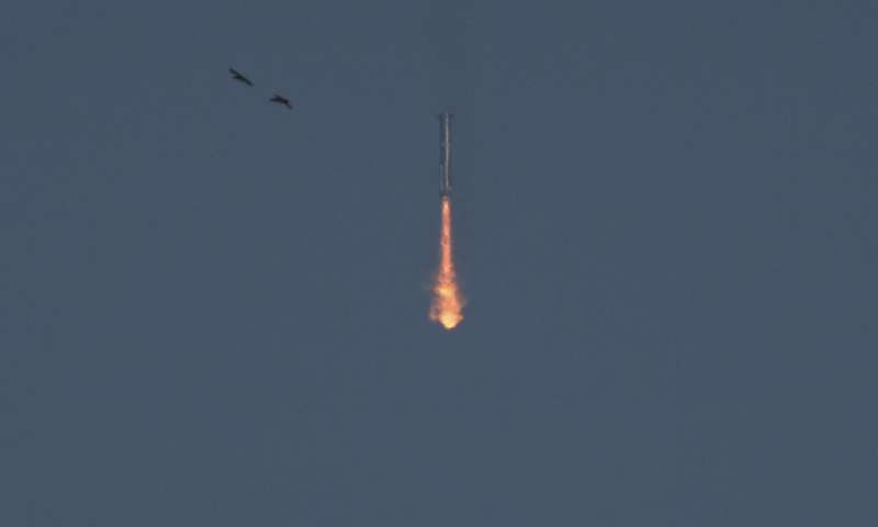 SpaceX launches giant Starship rocket, but aborts attempt to catch booster with mechanical arms