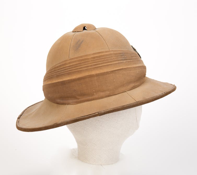 A hat made of a brown material with a flat rim.