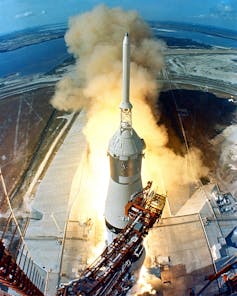 A bird's eye view of a rocket blasting off.