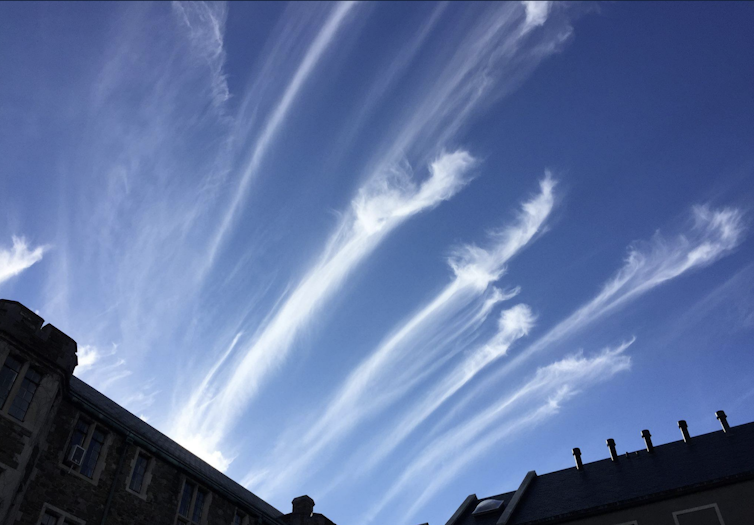 Streaks of high white clouds look like paintbrush strokes