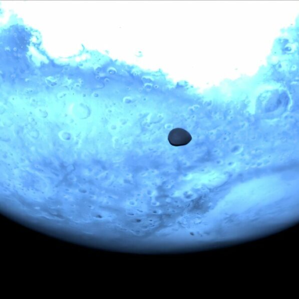 Asteroid probe snaps rare pics of Martian moon