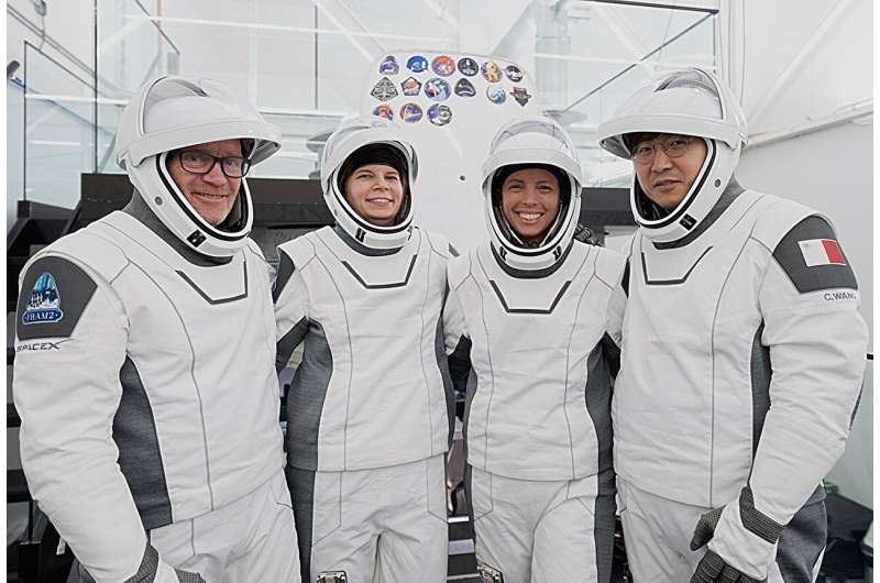 Four space tourists return to Earth after a private flight over the poles