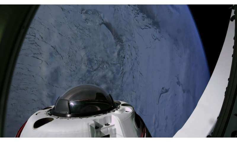 Four space tourists return to Earth after a private flight over the poles