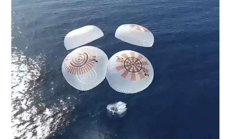 Four space tourists return to Earth after a private flight over the poles