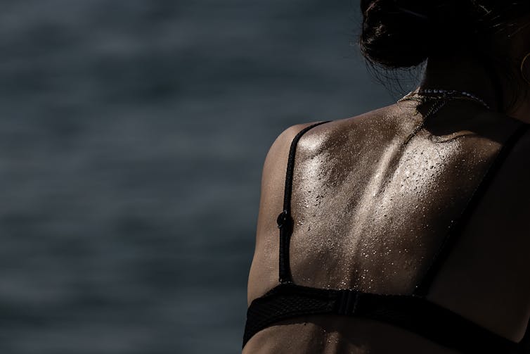 The back of a sweaty person.
