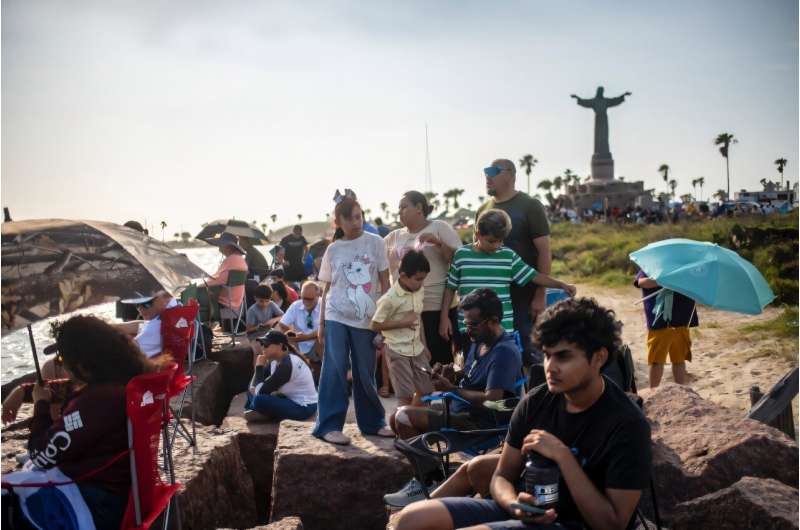 People wait on South Padre Island to watch the SpaceX Starship rocket launch from Starbase, Texas, on May 27, 2025. People wait on South Padre Island to watch the SpaceX Starship rocket launch from Starbase, Texas, on May 27, 2025