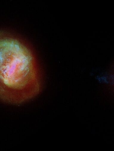 Stretched in a cross pattern: Our neighboring galaxy is pulled in ...