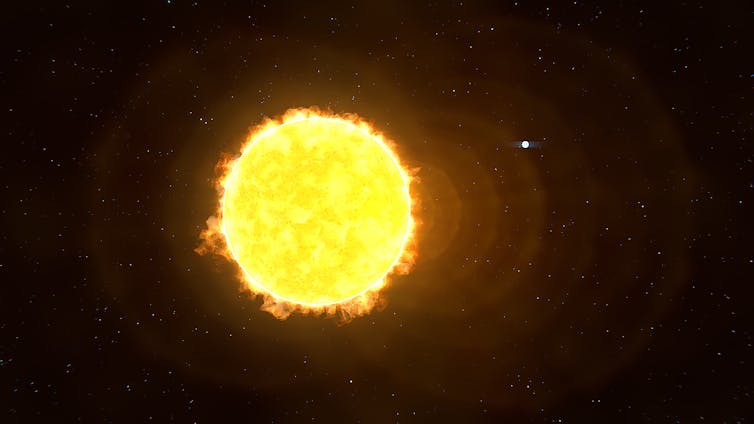 An illustration showing a large bright circle, with a very small white dot nearby.