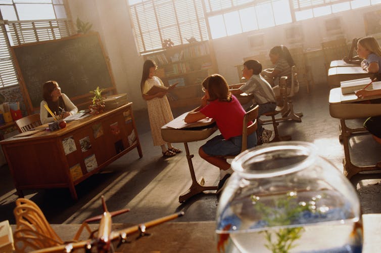 Young girl reading in classroom